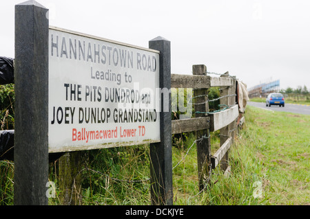Sign at the Hannahstown Road, part of the Dundrod 150 road race, leading to the Joey Dunlop grandstand and course pits. Stock Photo