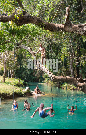 Vertical view of tourists at Poukham Cave aka Tham Phu Kham and the Blue Lagoon along the Nam Song river near Vang Vieng. Stock Photo
