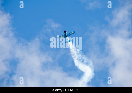 Horizontal view of an aircraft doing stunts during an air display. Stock Photo