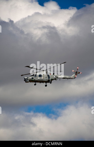 Vertical close up of a Westland Lynx helicopter flying in the sky. Stock Photo