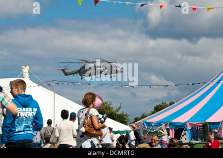 Horizontal close up of two Westland Lynx helicopters flying side by side during an air show. Stock Photo