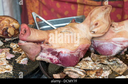 pigs head with ears and nose as food on the market Stock Photo