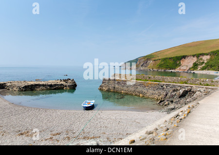 Solo lonely dinghy moored in small harbour Stock Photo