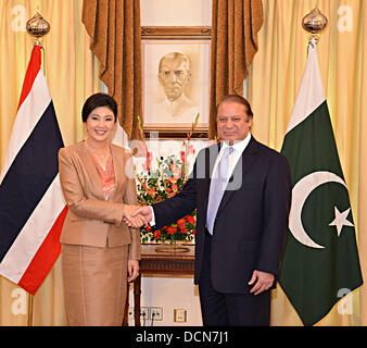 Islamabad, Pakistan. 20th August 2013. Prime Minister Muhammad Nawaz Sharif shaking hand with H.E. Ms Yingluck Shinawatra, Prime Minister of Thailand on her arrival at Prime Minister’s House on August 20, 2013.      (PHOTO BY PID/Deanpictures/Alamy Live News Stock Photo