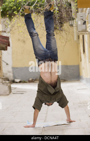 Man doing handstand Stock Photo