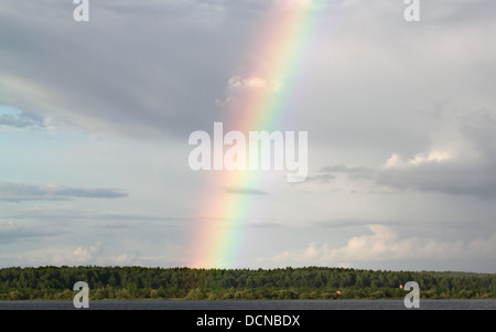 Multi-colored rainbow in the sky Stock Photo