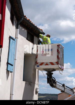 New street lights being fitted in the hilltop village of Bellegarde-du-Razes Aude Languedoc France Stock Photo