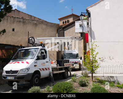 New street lighting being fitted in the hilltop village of Bellegarde-du-Razes Languedoc France Stock Photo