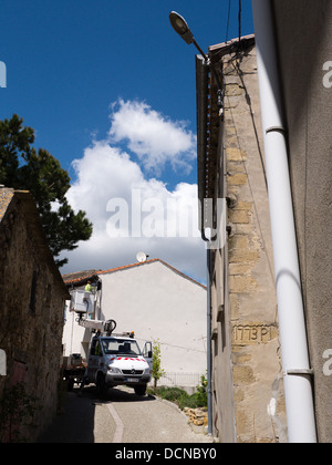 New street lamps being fitted in the French hilltop village of Bellegarde-du-Razes Aude France Stock Photo