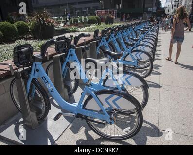Chicago, Illinois, USA. 19th Aug, 2013. Bikes are seen at a Divvy Station on Monday, August. 19, 2013 in Chicago, Illinois. Divvy is a bicycle sharing system that launched in Chicago on June 28, 2013 with 750 bikes at 75 stations spanning from the Loop north to Fullerton Ave, west to Damen Ave, and south to 23rd St. The system is planned to grow to 3000 bikes at 300 stations by August 2013 and 4,000 bicycles at 400 stations by Spring 2014. © Ringo Chiu/ZUMAPRESS.com/Alamy Live News Stock Photo