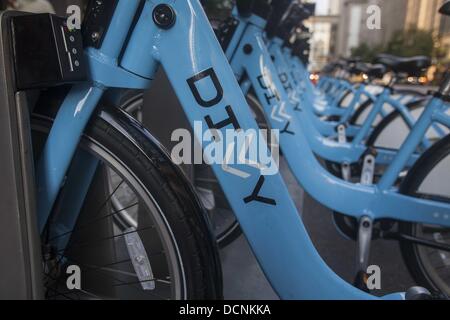 Chicago, Illinois, USA. 20th Aug, 2013. Bikes are seen at a Divvy Station on Tuesday August. 20, 2013 in Chicago, Illinois. Divvy is a bicycle sharing system that launched in Chicago on June 28, 2013 with 750 bikes at 75 stations spanning from the Loop north to Fullerton Ave, west to Damen Ave, and south to 23rd St. The system is planned to grow to 3000 bikes at 300 stations by August 2013 and 4,000 bicycles at 400 stations by Spring 2014. © Ringo Chiu/ZUMAPRESS.com/Alamy Live News Stock Photo