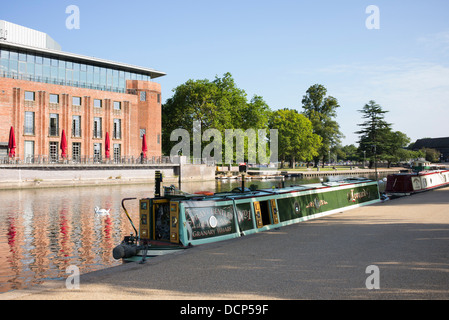 Canal boat on the river Avon opposite The RSC theatre, Waterside, Stratford upon Avon, Warwickshire, England Stock Photo