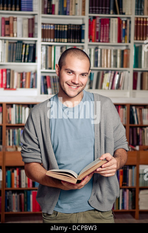 Portrait Of Male Student Standing In College Building Stock Photo - Alamy