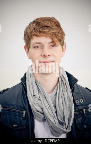 Portrait of real young man on simple background Stock Photo