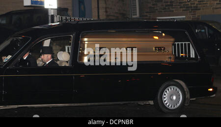 Jimmy Savile gold coffin leaves the undertakers in Bradford  and makes its way to the Queens hotel in Leeds  where the body of the late broadcaster will be lying in state for one day.  Fans and well wishers will be able to pay their respects and say goodb Stock Photo