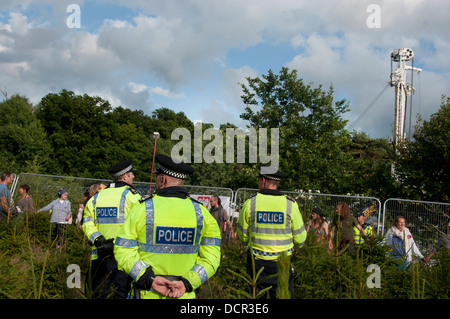Site of Cuadrilla drilling. Demonstration against fracking. Protesters surround the  drilling rig which is guarded by police. Stock Photo