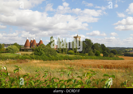 Horsmonden Kent Oast House and St Margaret's Church England UK Stock Photo