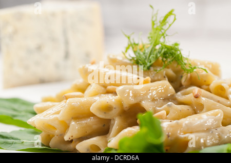 Italian pasta penne gorgonzola and pine nuts Stock Photo