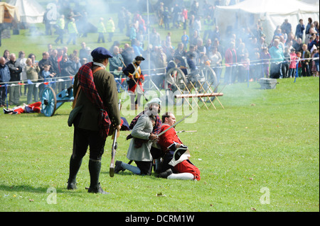 Redcoats battle the Jacobites during a re-enactment at Scotland's Festival of History at Chatelherault South Lanarkshire Stock Photo