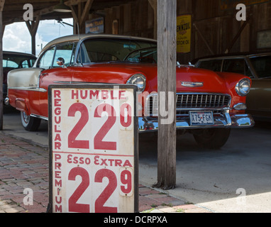 San Antonio, Texas - A Chevrolet from the 1950s and a gasoline price sign on display at the SAS shoe factory and general store. Stock Photo