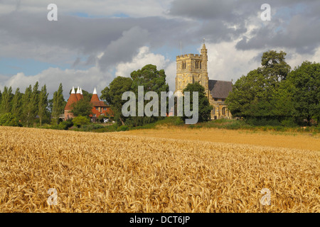 Harvest time at picturesque Horsmonden, Kent. St Margaret's Church and Oast House, England Britain UK. Wealden Kent Countryside Stock Photo