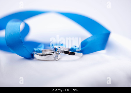 wedding rings in a blue ribbon Stock Photo