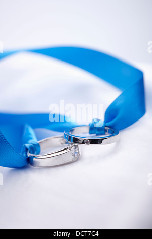 wedding rings in a blue ribbon Stock Photo - Alamy
