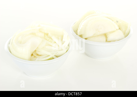 Cutted onions in white bowls Stock Photo