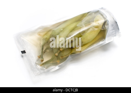 Hot chili  peppers in plastic packaging on white Stock Photo