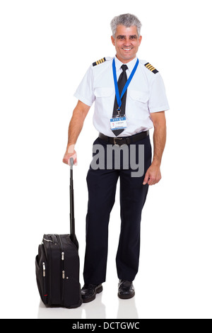senior airline pilot wearing uniform standing next to briefcase