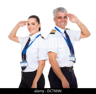beautiful female first officer and senior captain saluting over white background Stock Photo
