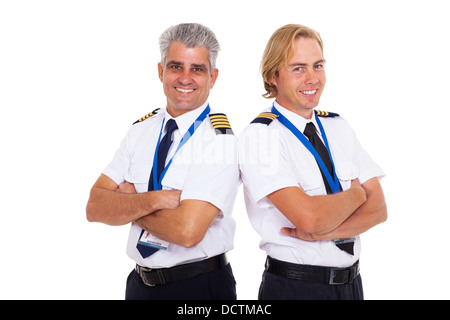 two airline pilots wearing uniform portrait on white background Stock Photo