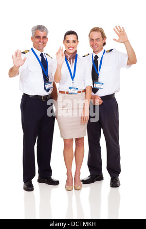 cheerful airline pilots and airhostess waving on white background Stock Photo