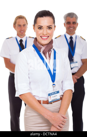 attractive airhostess standing in front of pilots on white background Stock Photo