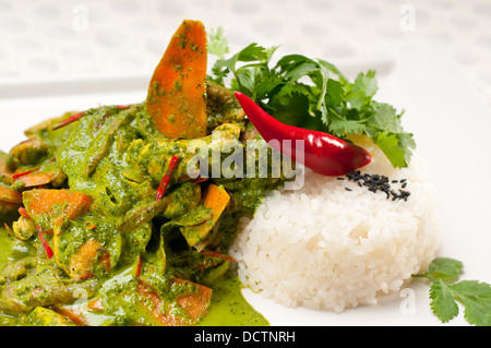 chicken with green curry vegetables and rice Stock Photo