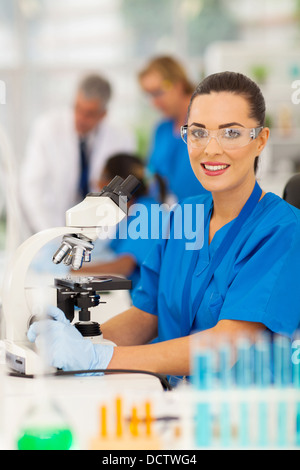 beautiful young female lab technician in laboratory Stock Photo