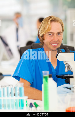 cheerful lab technician working in laboratory Stock Photo