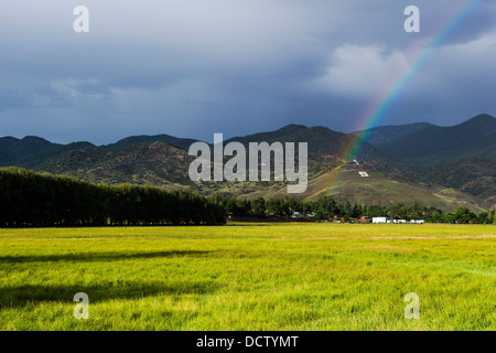 Rainbow over the small mountain town of Salida, Colorado, USA Stock Photo