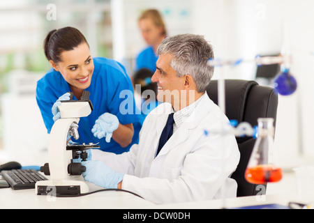 group of lab technicians working in laboratory Stock Photo