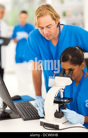university students experimenting in research lab Stock Photo