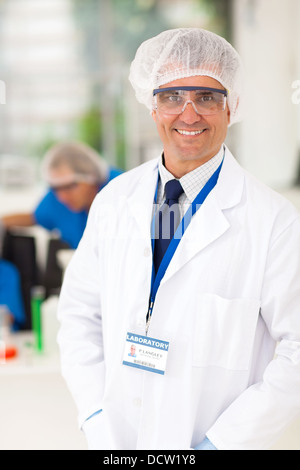 smiling senior microbiology specialist in laboratory Stock Photo