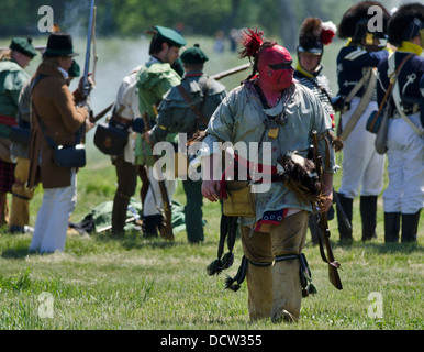 A re enactor of a native warrior on the battlefield for the re enactment of the Battle of Fort George. Stock Photo