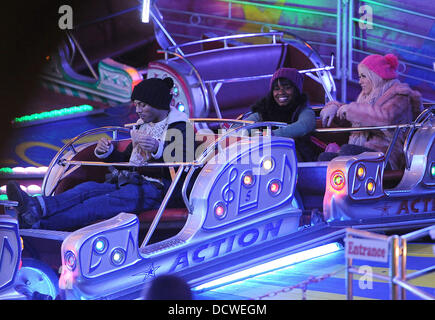 X Factor contestant Marcus Collins Misha B and  Amelia Lily  enjoy a night out at Winter Wonderland.  London, England - 24.11.11 Stock Photo