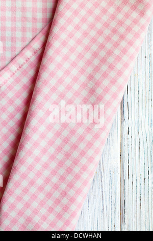 the checkered napkin on white wooden table Stock Photo
