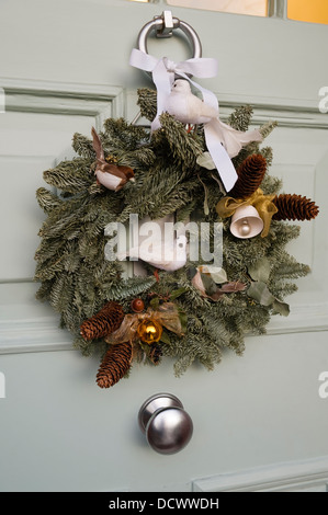 Christmas wreath on front door of North London Victorian home Stock Photo