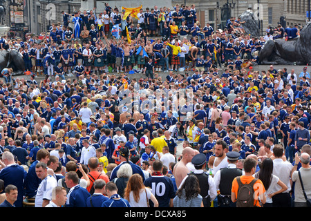 Big crowd of Scotland football fans viewed looking down from above in Trafalgar Square prior to an international match at Wembley London England UK Stock Photo