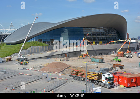 Queen Elizabeth Olympic Park futuristic Aquatic Centre removal of temporary stands showing installation of new side walls Stratford East London UK Stock Photo