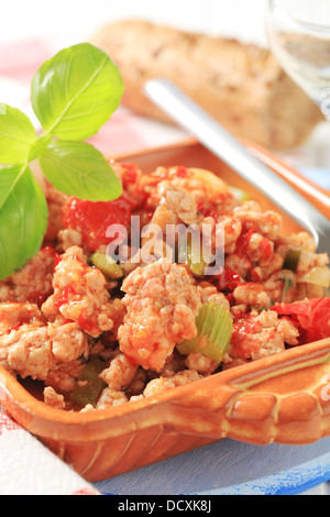 Ground meat stir fry in a ceramic dish Stock Photo