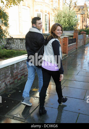 Harry Judd and girlfriend Izzy Johnston  leaving Fearne Cotton's house after her Christmas Party London, England - 22.12.11 Stock Photo