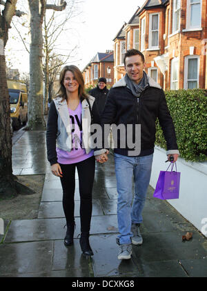 Harry Judd and girlfriend Izzy Johnston  leaving Fearne Cotton's house after her Christmas Party London, England - 22.12.11 Stock Photo